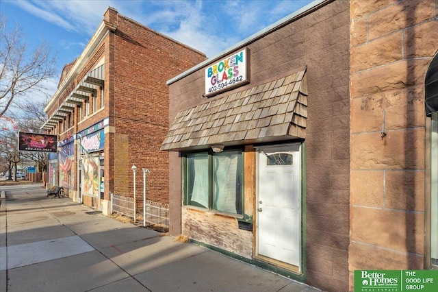 view of property exterior featuring brick siding