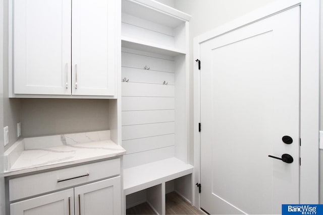 mudroom with wood finished floors