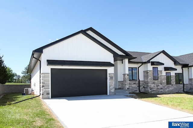 view of front of home with stone siding, concrete driveway, board and batten siding, and an attached garage