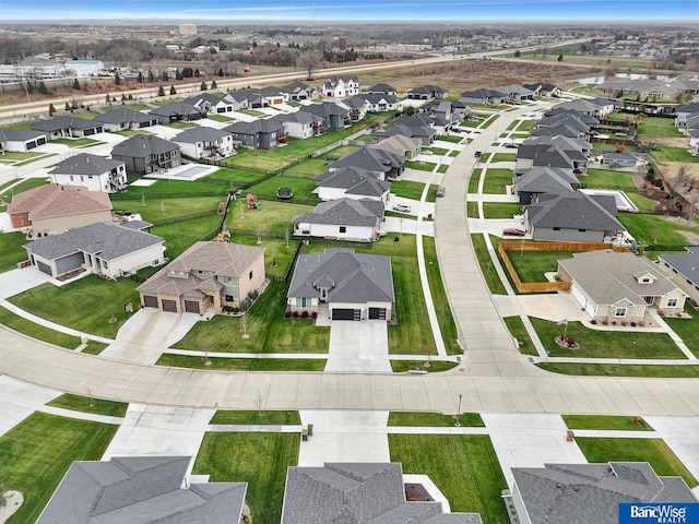 birds eye view of property with a residential view