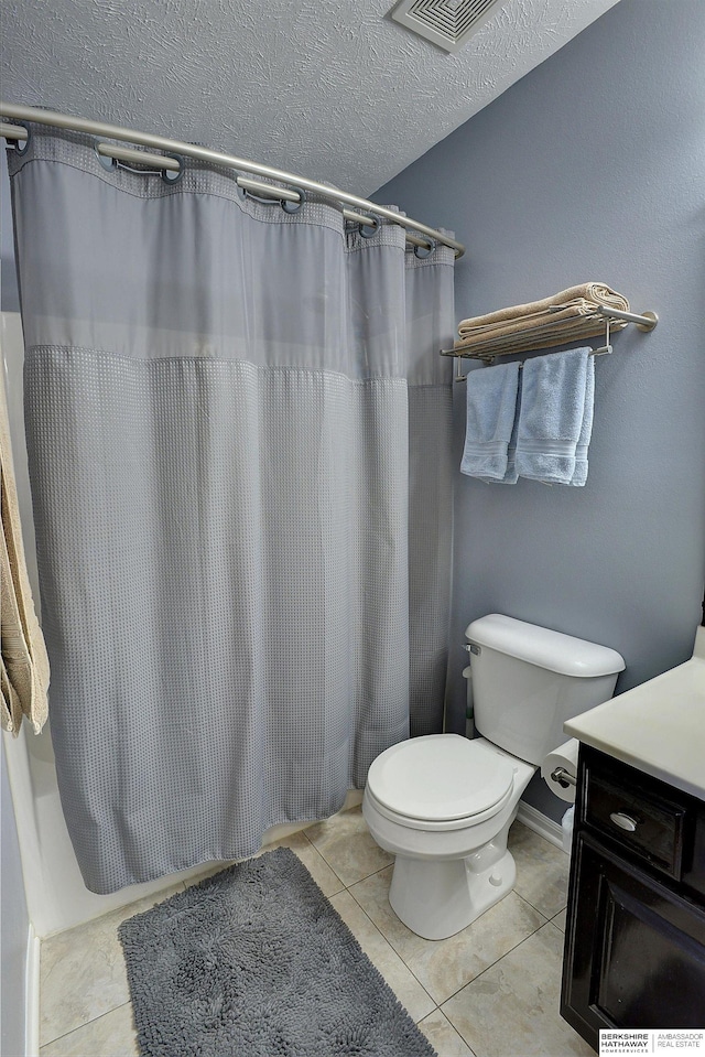 bathroom featuring visible vents, curtained shower, toilet, tile patterned floors, and a textured ceiling