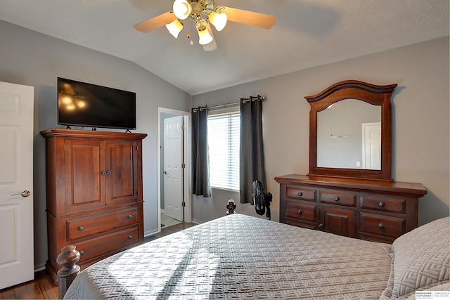 bedroom featuring wood finished floors, ceiling fan, and vaulted ceiling