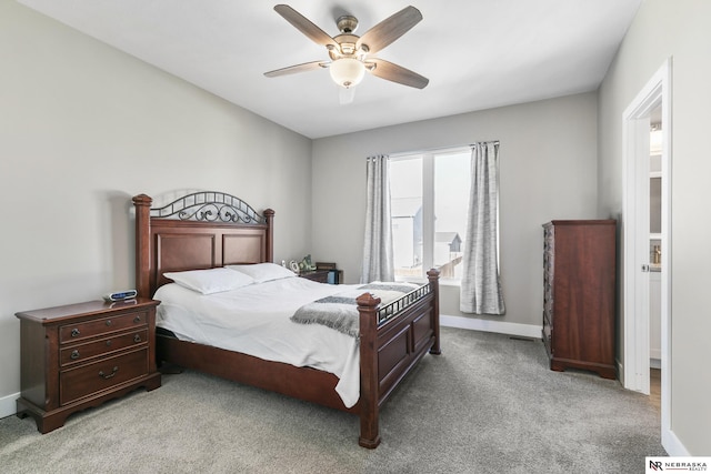 bedroom with baseboards, a ceiling fan, and light colored carpet