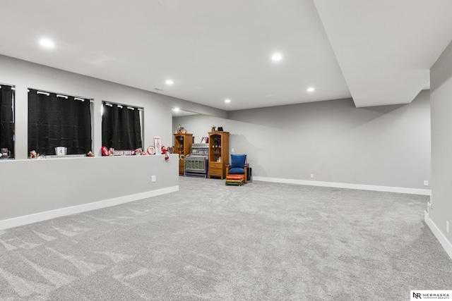 finished below grade area featuring baseboards, carpet flooring, and recessed lighting