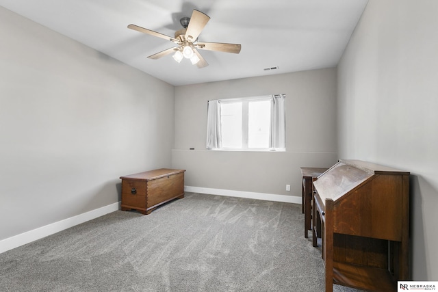 miscellaneous room with carpet floors, visible vents, baseboards, and a ceiling fan