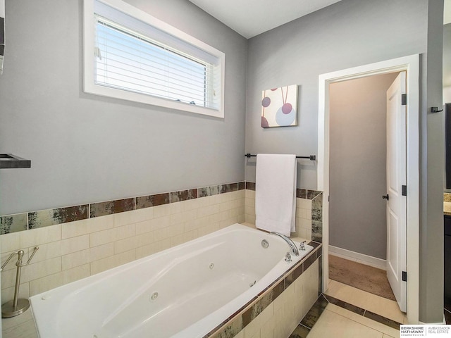 full bath featuring a whirlpool tub and tile patterned floors