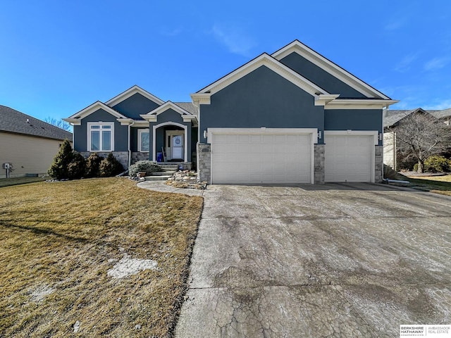 view of front of house with driveway, a garage, stone siding, stucco siding, and a front yard