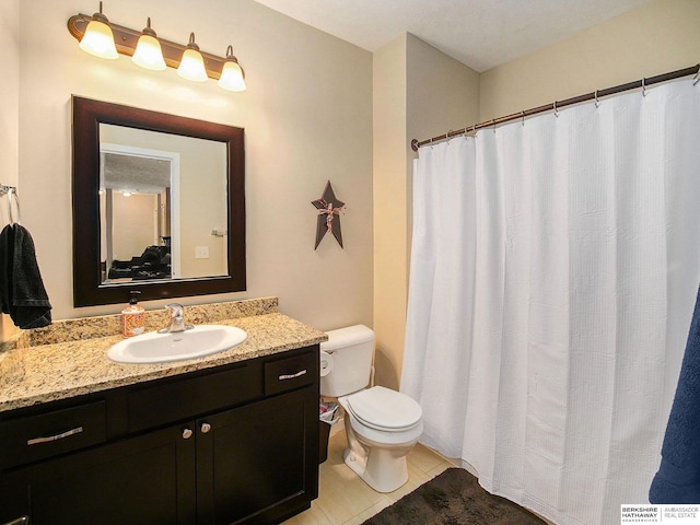 full bathroom with tile patterned flooring, vanity, and toilet