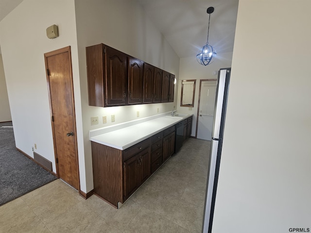 kitchen with light countertops, hanging light fixtures, a sink, dark brown cabinets, and high vaulted ceiling