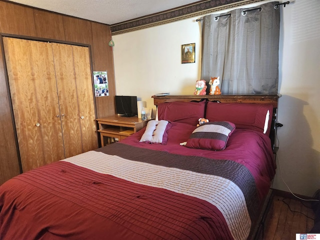 bedroom with a closet and wood finished floors