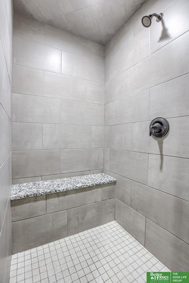 full bath featuring tiled shower