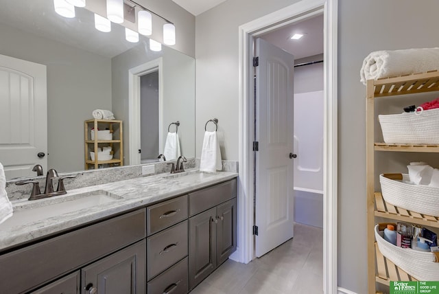 bathroom with double vanity and a sink