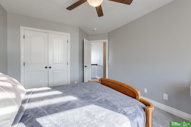 carpeted bedroom with baseboards, a closet, and ceiling fan