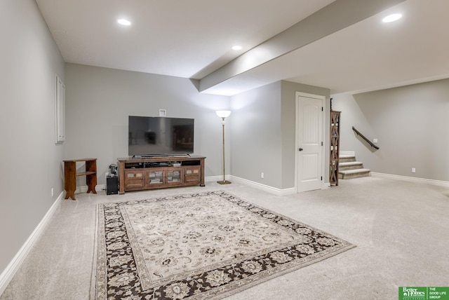 living area featuring stairs, recessed lighting, and carpet