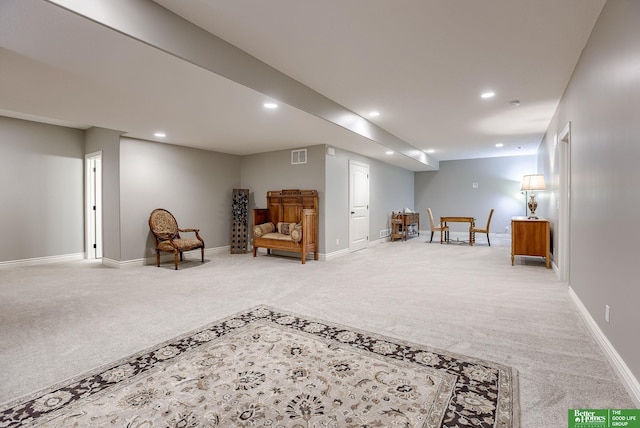 sitting room with recessed lighting, light colored carpet, baseboards, and visible vents