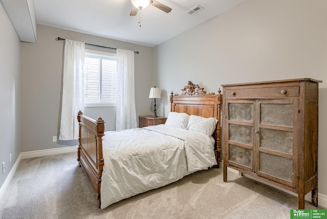 carpeted bedroom featuring visible vents, ceiling fan, baseboards, and vaulted ceiling