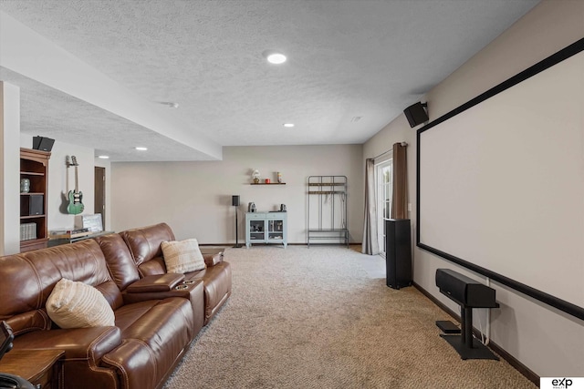 home theater room featuring recessed lighting, baseboards, a textured ceiling, and light colored carpet