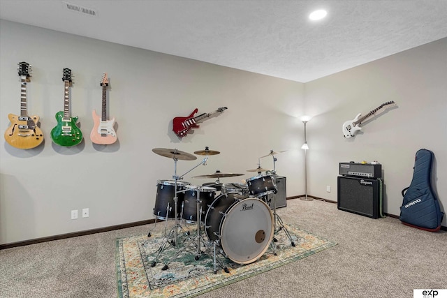 rec room featuring carpet, visible vents, and baseboards