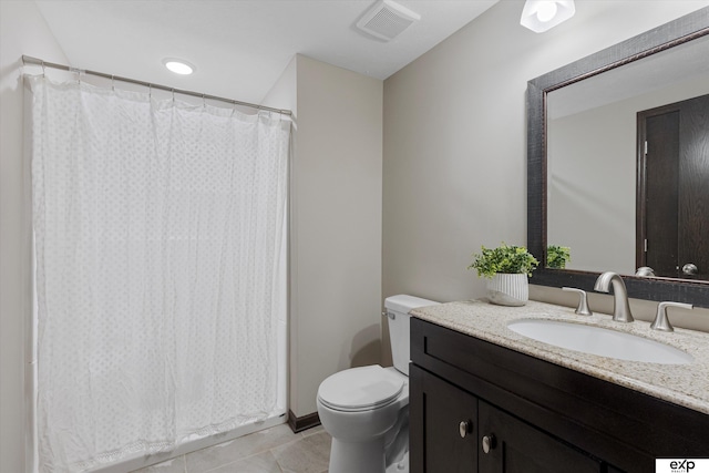 bathroom featuring toilet, tile patterned flooring, visible vents, and vanity