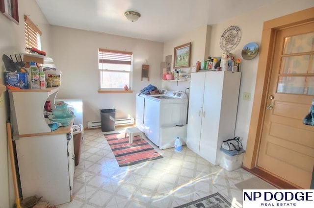 laundry area featuring laundry area, a baseboard radiator, washing machine and clothes dryer, baseboard heating, and light floors