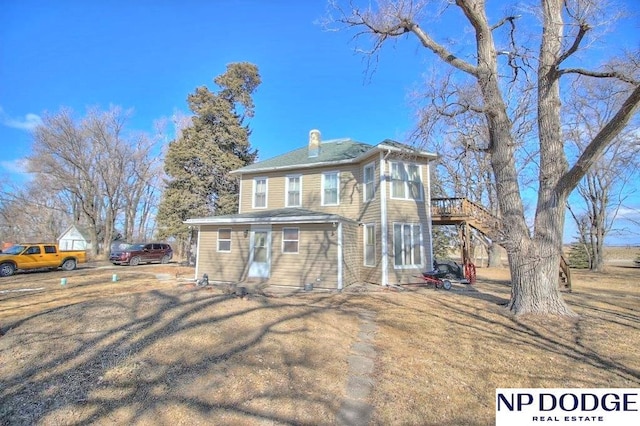 view of front of house with entry steps and a deck