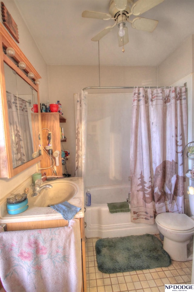 full bath with shower / bath combo, ceiling fan, vanity, and toilet