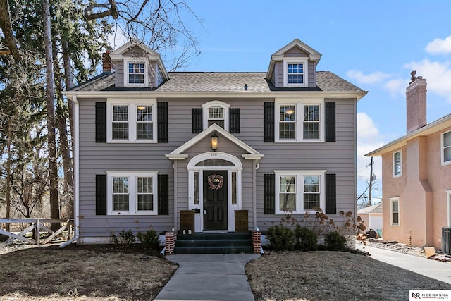 view of front of house with a shingled roof