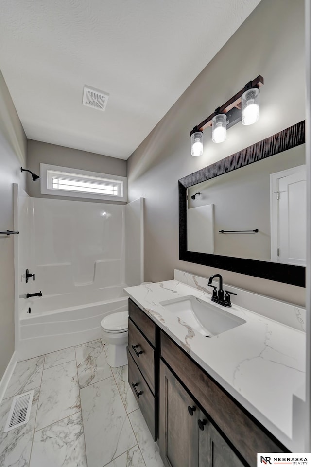 full bath with shower / bath combination, marble finish floor, visible vents, and vanity