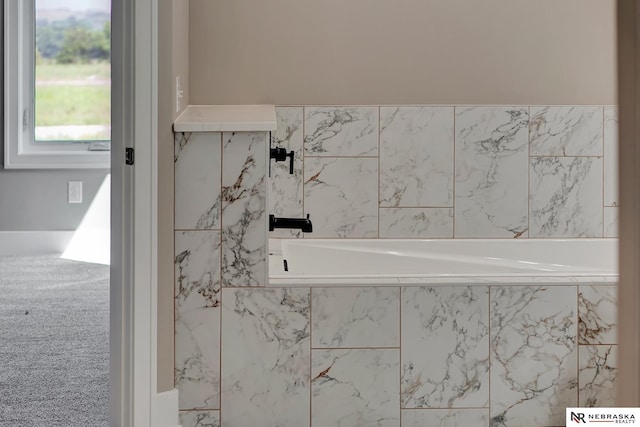 full bath with a relaxing tiled tub