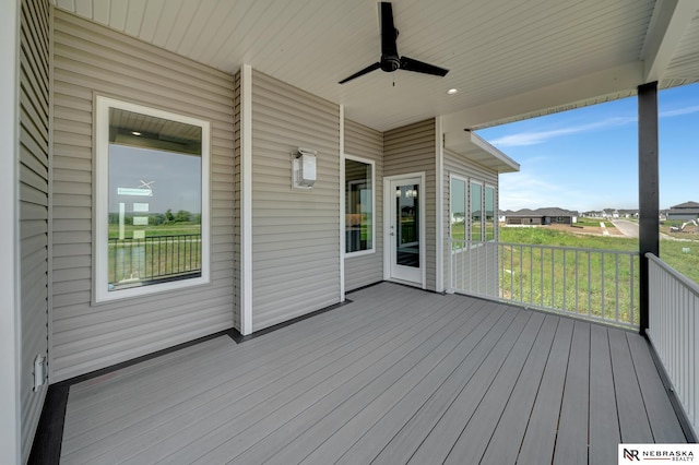 wooden deck with ceiling fan