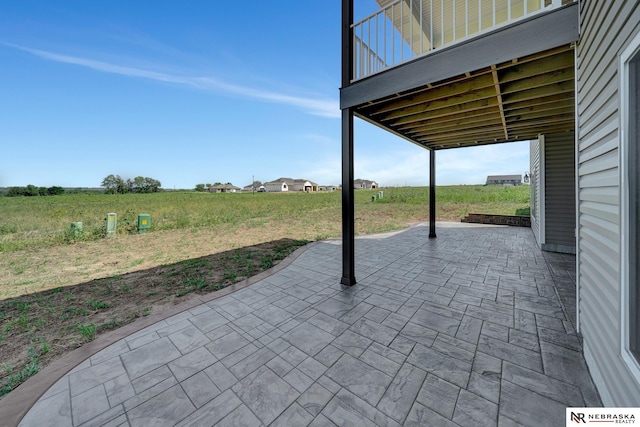 view of patio / terrace with a rural view