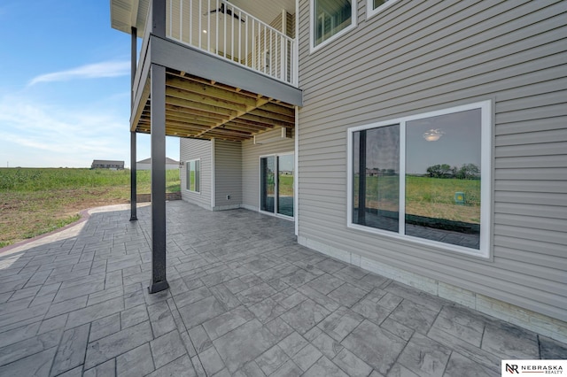 view of patio featuring a balcony