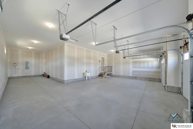 garage with electric panel and a garage door opener