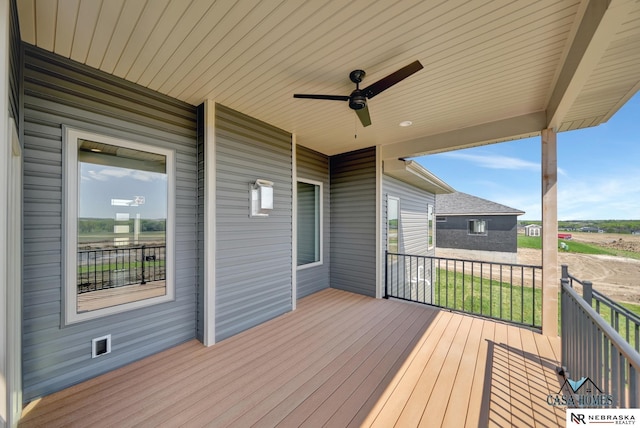 wooden deck with ceiling fan