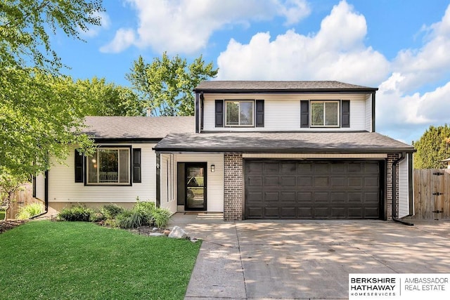 800 W Perry St, Papillion, NE 68046 - tri-level home featuring an attached garage and concrete driveway