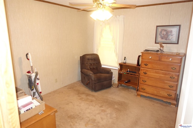 sitting room with ceiling fan and light colored carpet