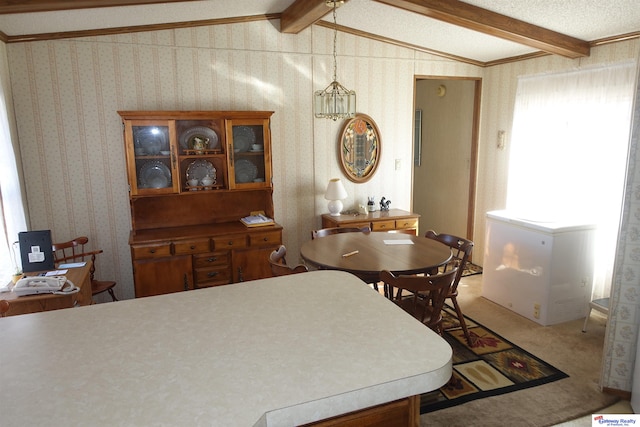 dining area with carpet flooring, lofted ceiling with beams, and wallpapered walls