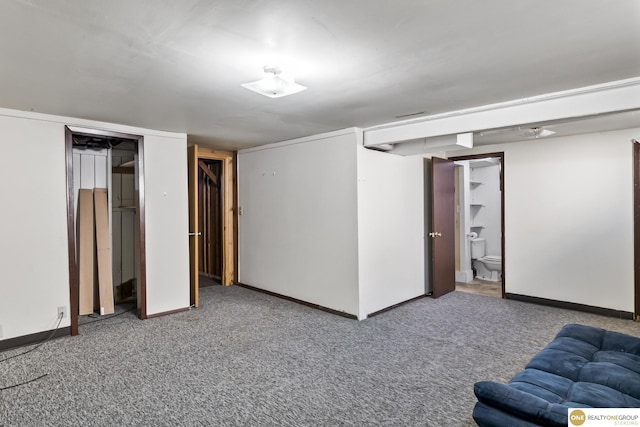 finished basement featuring carpet flooring and baseboards