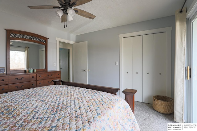 bedroom featuring a textured ceiling, ceiling fan, and a closet