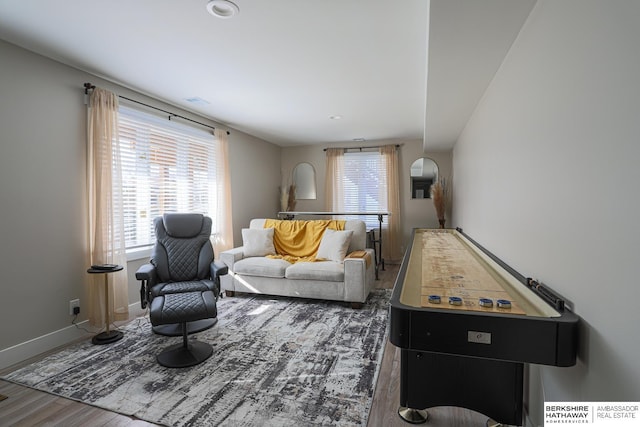 playroom with dark wood-style flooring, a healthy amount of sunlight, and baseboards