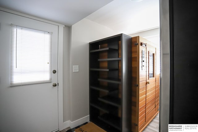 entryway featuring baseboards