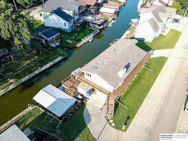 birds eye view of property featuring a water view and a residential view