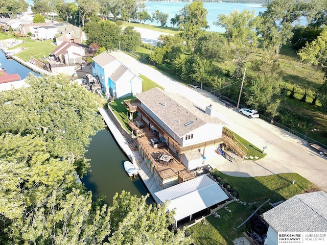 birds eye view of property featuring a water view and a residential view