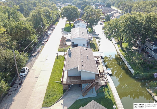 birds eye view of property featuring a water view and a residential view