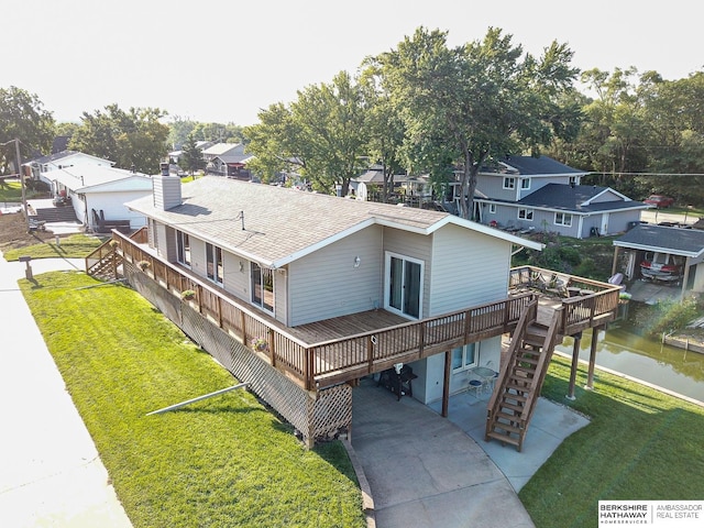 bird's eye view featuring a water view and a residential view