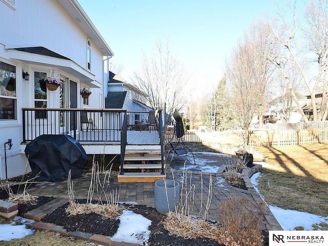 view of yard with a deck and fence