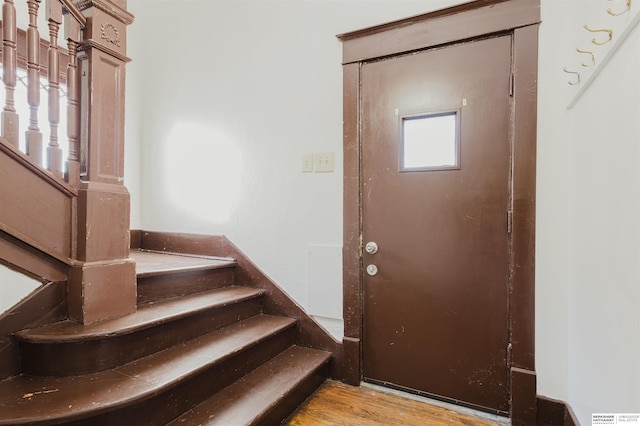 entrance foyer with light wood finished floors and stairs