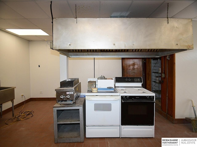 kitchen featuring a paneled ceiling, electric range, baseboards, and electric stove