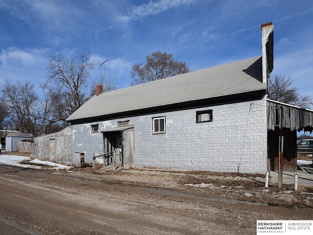 exterior space featuring a chimney