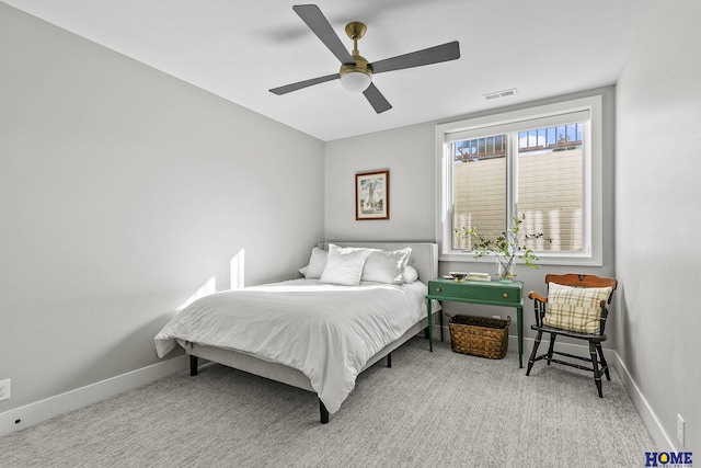 bedroom featuring carpet, baseboards, visible vents, and ceiling fan